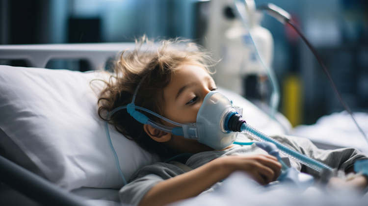 Stock photograph of child with oxygen mask